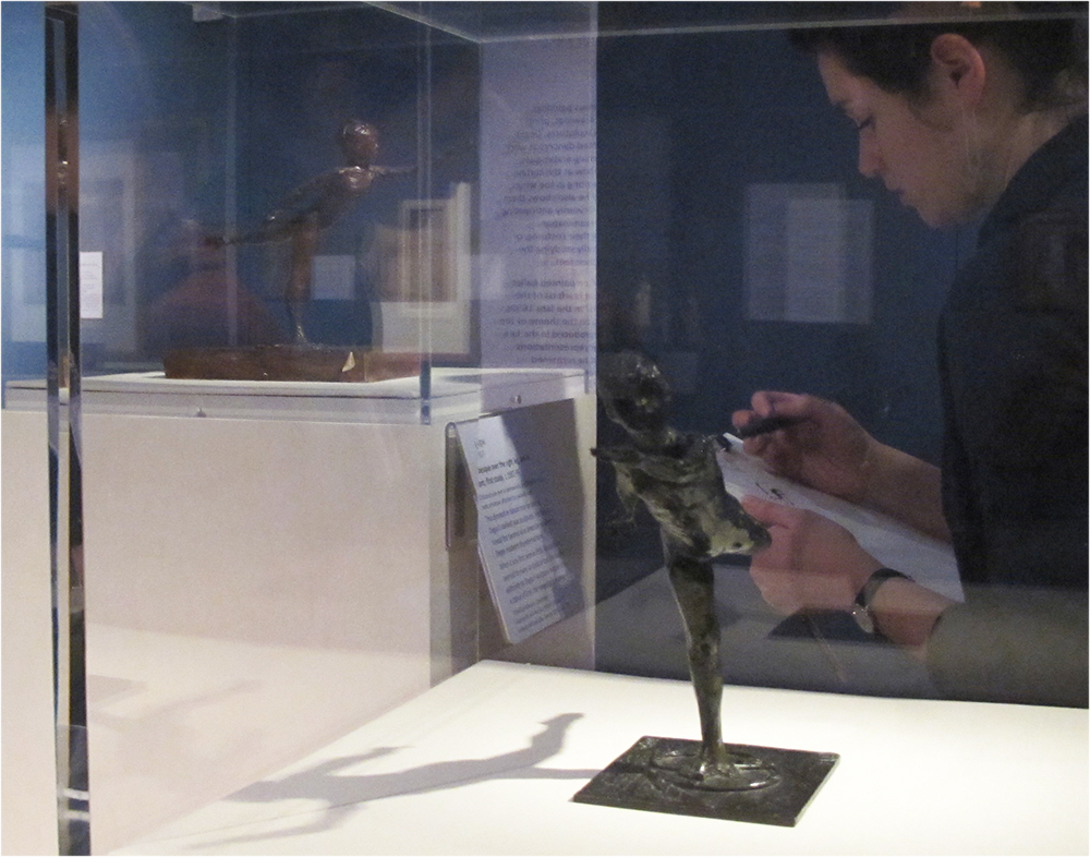 Teacher drawing from Degas sculptures: Arabesque over the Right Leg, Left Arm in Front, First Study, copper alloy C.119 (foreground) Arabesque over the Right Leg, Left Arm in Front, First Study, coloured wax, C.114 (background) 