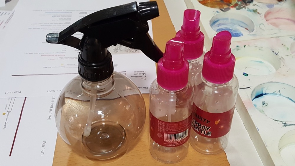 Water spray bottles used for dampening the paper and dispersing Brusho Crystals 