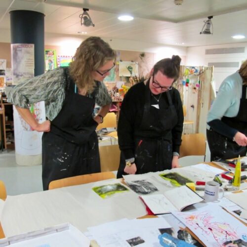 Teacher working on a production of prints and sharing her work with Kate - SC Fitz