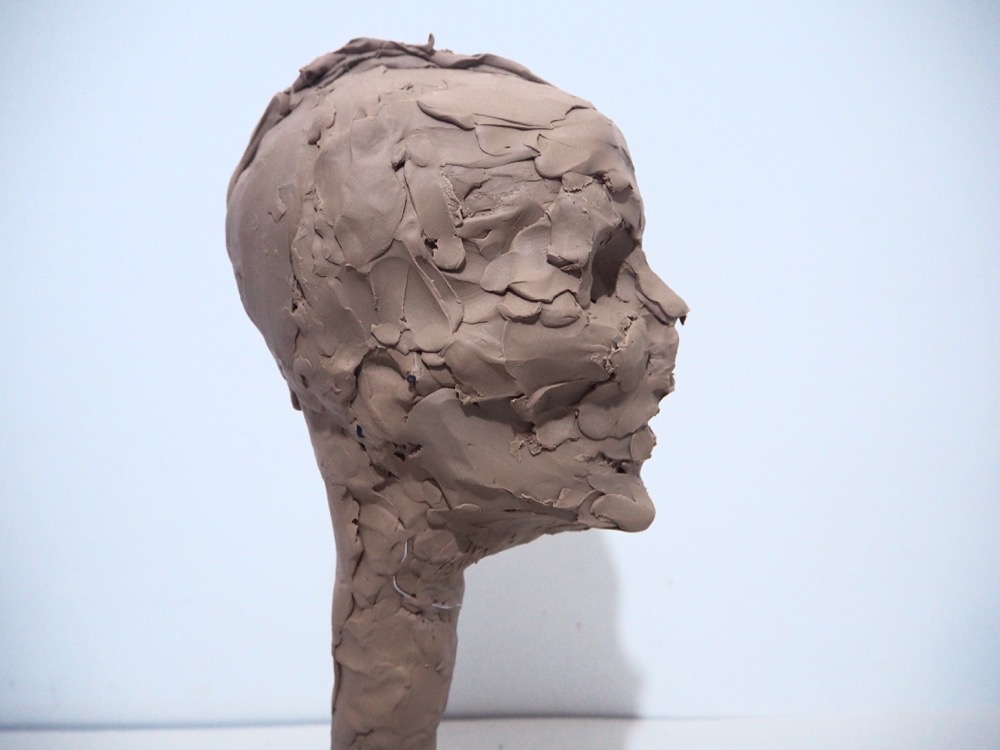 Sculpting a head in clay 