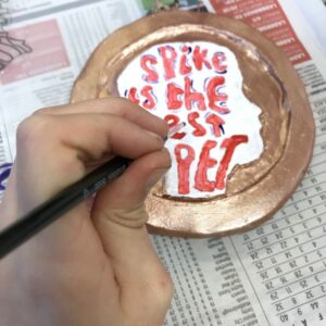 Explore making medals from clay and paint