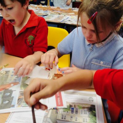 Children apply gold leaf to gild their painted leaves at Hauxton Primary School with Pamela Stewart for Inspire