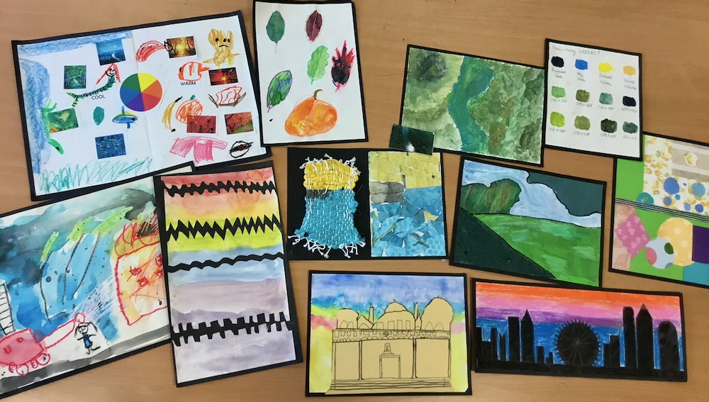 A selection of colourful paintings by children from years two until five of varying ability