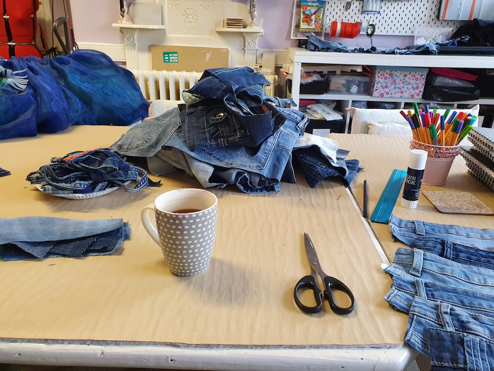 Pile of denim ready to be transformed into Psyche's dress with teacher Natalie Bailey - Fitzy Peters - Inspire