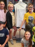 Six, ten year old children - called the Fitzy Peters from Wisbech, Cambridgeshire, posing in front of a mannequin as part of the Inspire Project with the Fitzwilliam Museum, Cambridge and AccessArt - photo by their teacher Natalie Bailey