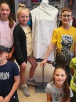 Six, ten year old children - called the Fitzy Peters from Wisbech, Cambridgeshire, posing in front of a mannequin as part of the Inspire Project with the Fitzwilliam Museum, Cambridge and AccessArt - photo by their teacher Natalie Bailey