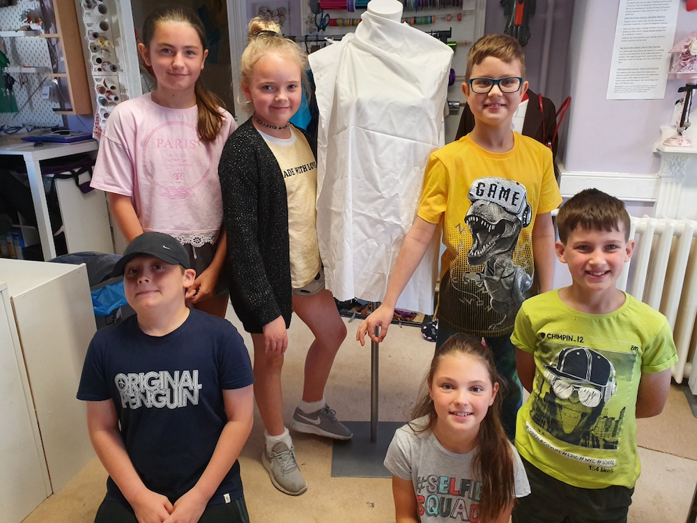 Six, ten year old children - called the Fitzy Peters from Wisbech, Cambridgeshire, posing in front of a mannequin as part of the Inspire Project with the Fitzwilliam Museum, Cambridge and AccessArt - photo by their teacher Natalie Bailey