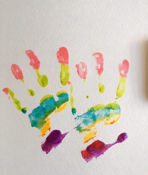 making rainbow hand prints on paper