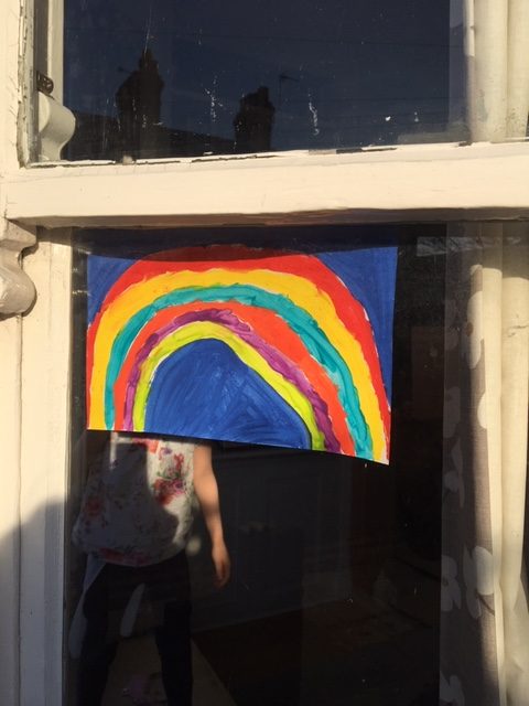 putting the rainbow up in the window