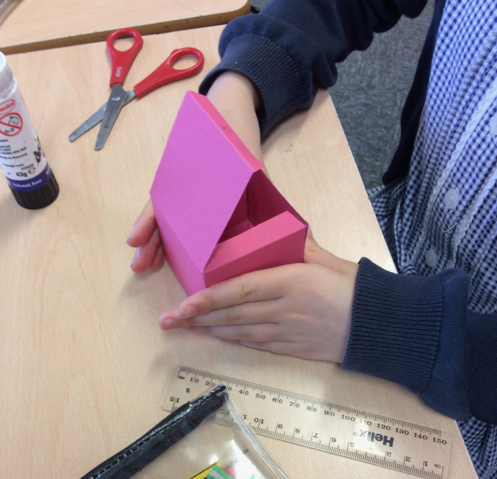 Final phase of folding a cut out net of a cube - Anna Campbell - Linton Heights - Inspire