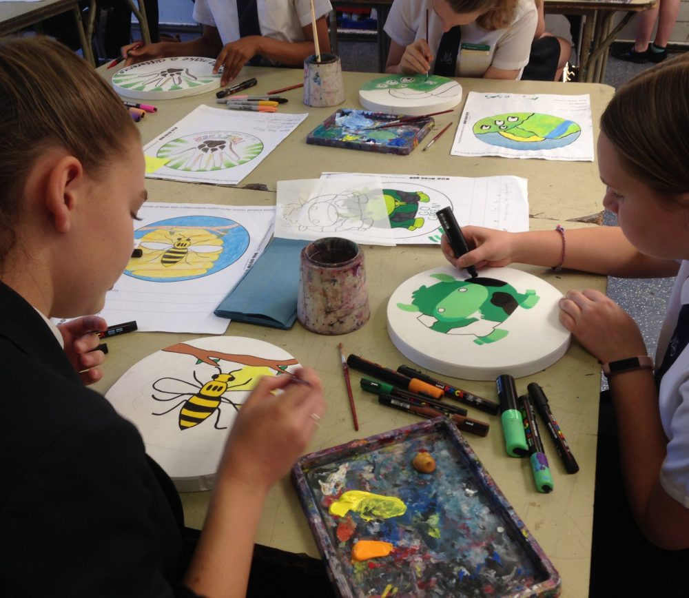 teenagers working on their designs