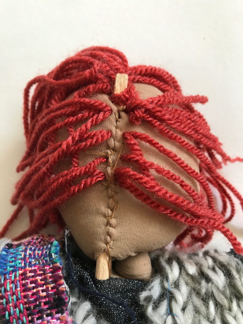 over stitching a rod to the back of the head