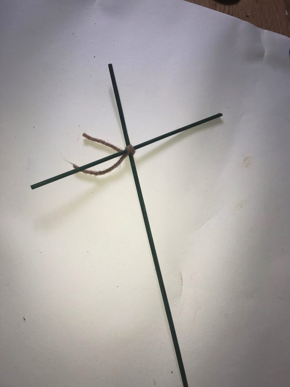 two rods joined in a cross shape