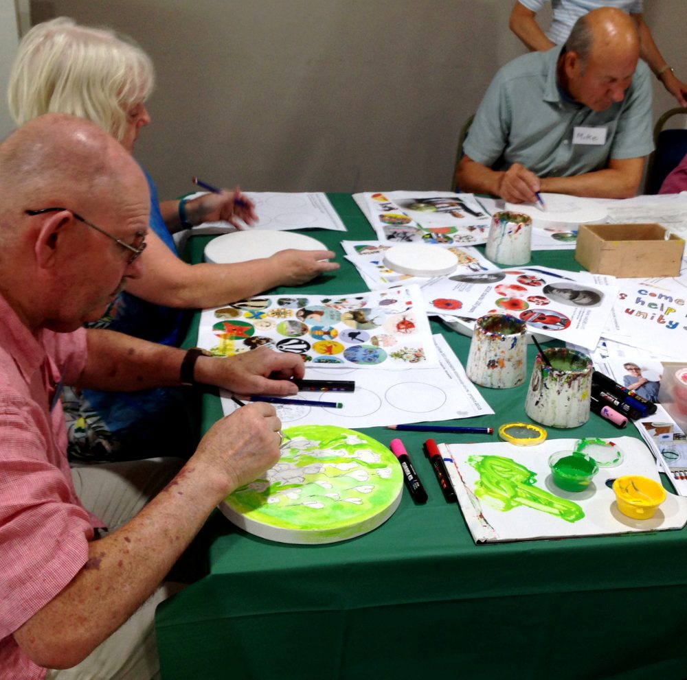 A senior citizen drop in art class