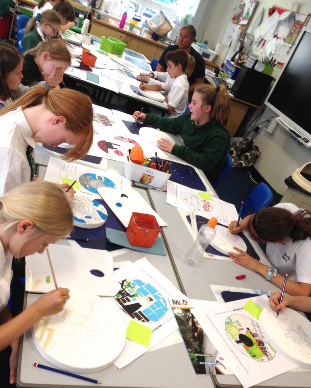 primary school children working on their designs