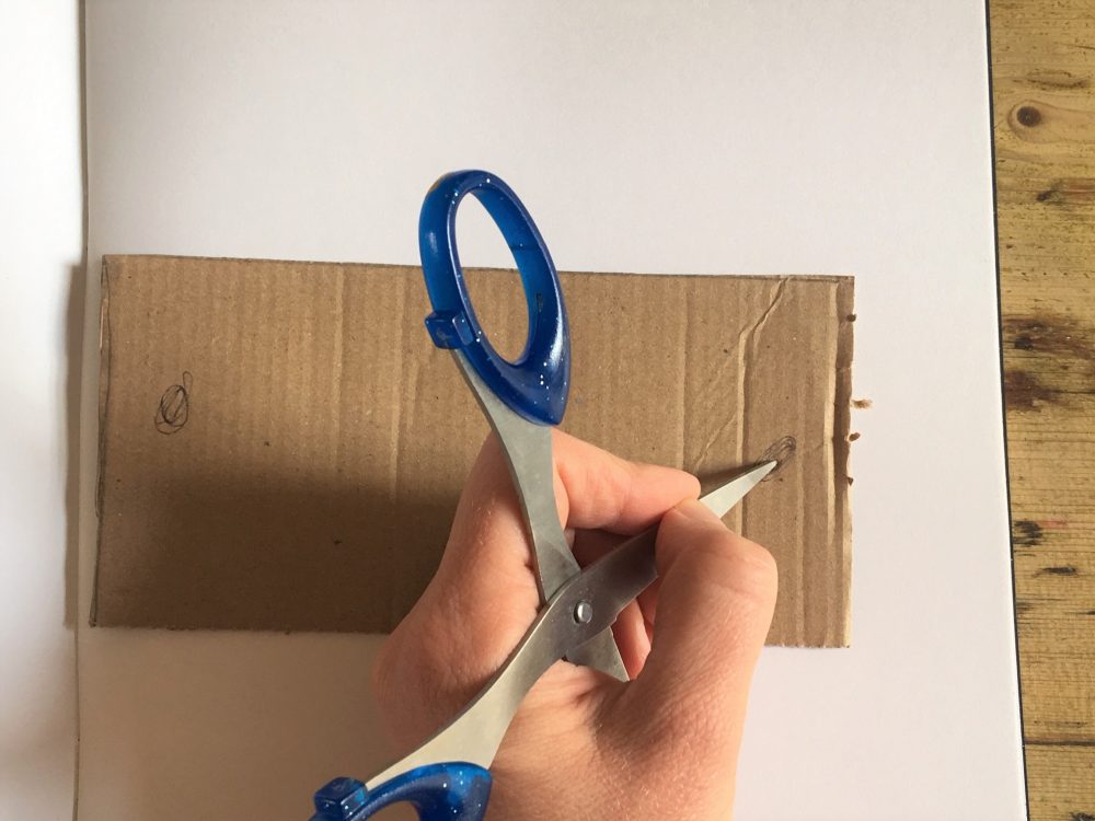 use sharp scissors to bore a hole ready for connecting together