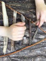 arranging twigs into a triangular formation