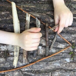 arranging twigs into a triangular formation