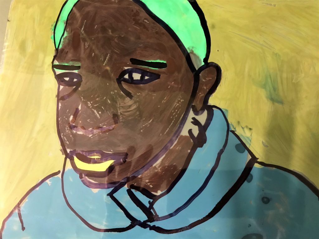 a portrait drawn on acetate with simple colour palette