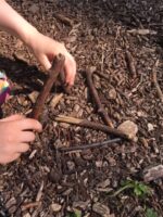 Trying to Balance Sticks by Rachel Thompson