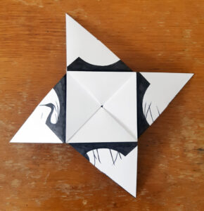 A folded origami puzzle purse by Eilis Hanson