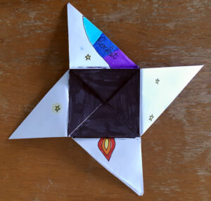 An unfolded origami puzzle purse created by children -by Eilis Hanson
