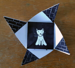 An unfolded origami puzzle purse created by children -by Eilis Hanson