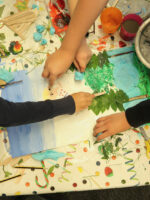 Children participating in a collaborative collage