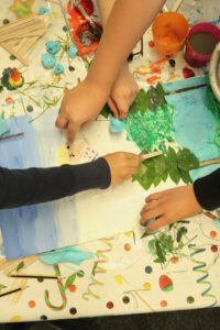 Children participating in a collaborative collage