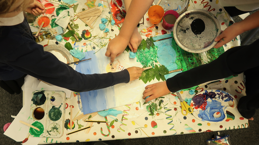 Children participating in a collaborative collage