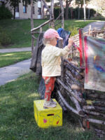 Child Painting The Fence By Mostyn de Beer