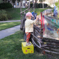 Child Painting The Fence By Mostyn de Beer