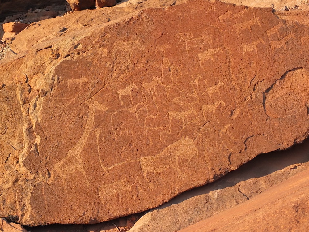 "Engravings at Twyfelfontein" by hobgadlng is licensed under CC BY-SA 2.0