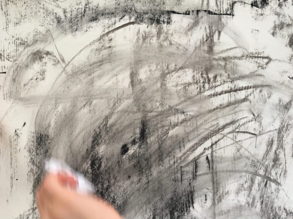 Rubbing into charcoal with a tissue