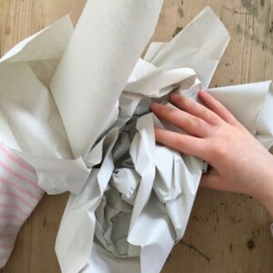 Scrunching up a piece of newsprint