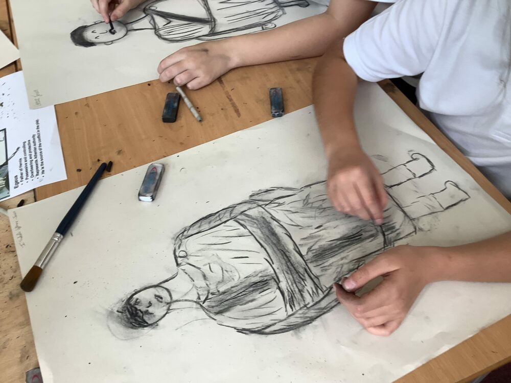 Using charcoal to create form and tone in a portrait.