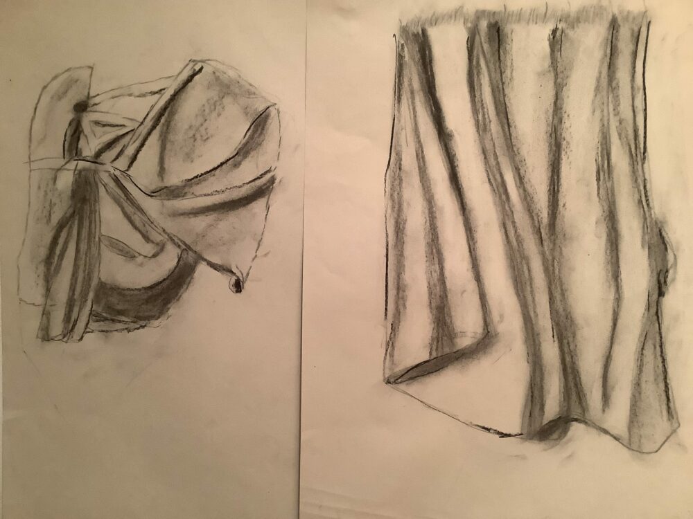 Charcoal drawing of folded fabric.