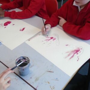 Using red water colour as 'blood on hands'