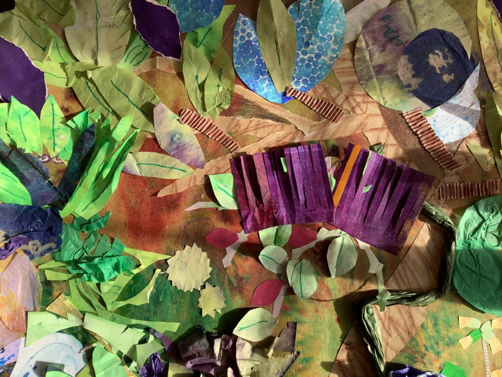 A close up of a paper collage of a forest.