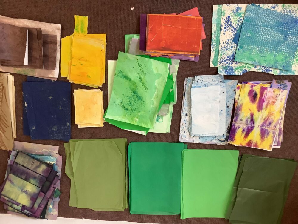 A selection of collage papers in green and brown.