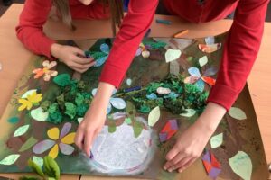 Adding moonlight and shadow to the forest collage to create mystery and intrigue.