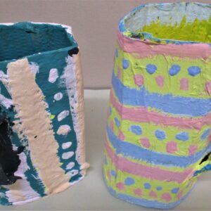 Two painted cardboard cups together.