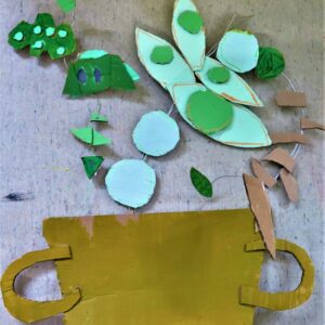 A finished collaged plant made with painted card and wire.