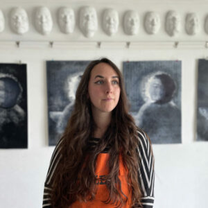 A portrait photo of artist Scarlett Rebecca.