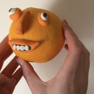 Plasticine Feature on an Orange by Tobi Meuwissen