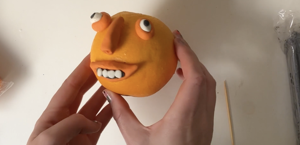 Plasticine Feature on an Orange by Tobi Meuwissen