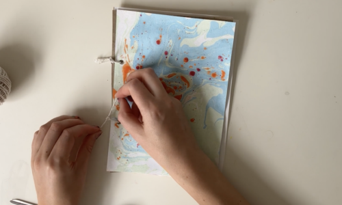 Create a marbled cover design for hole punch sketchbooks
