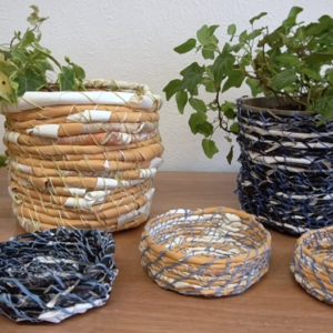 Scarlett Rebecca demonstrates how she takes old prints and repurposes them into baskets.