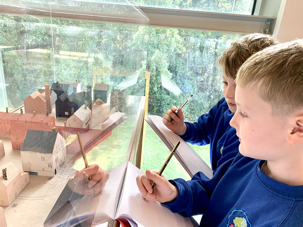 Boys Looking at Janine's Houses by Natalie Deane