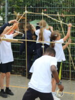 Constructing a frame out of bamboo canes.